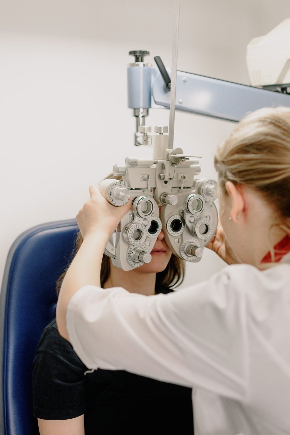 Crop ophthalmologist testing vision of patient